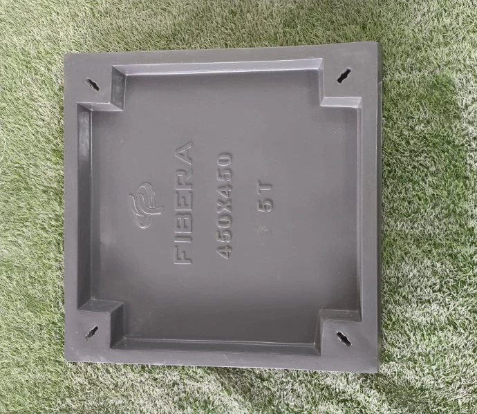 Flush-mounted composite square recessed manhole cover in concrete pavement